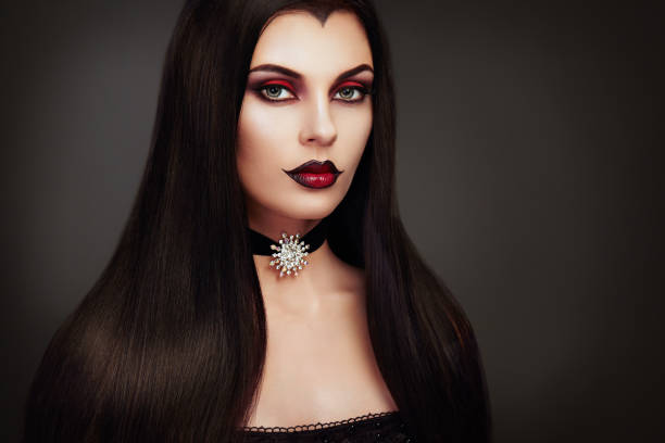 Halloween vampire woman portrait Halloween Vampire Woman portrait. Beautiful Glamour Fashion Sexy Vampire Lady with long dark Hair, beauty make up and Costume vampire woman stock pictures, royalty-free photos & images