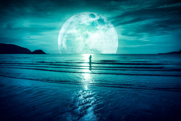 istock Super moon. Colorful sky with cloud and bright full moon over seascape. 861524294
