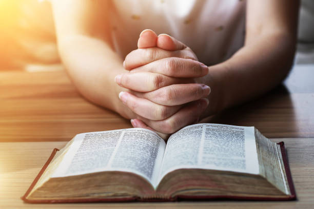 istock Women Reading holy Bible. 861534918