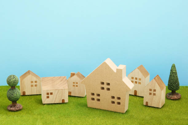 istock Houses on green grass over blue sky. 861545536