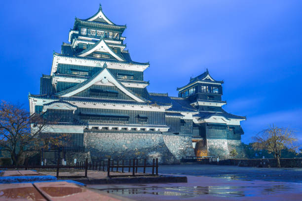 Kumamoto Castle at night in Chuoku, Kumamoto, Japan.