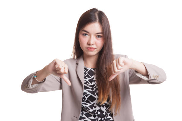 istock Unhappy Asian girl show thumbs down with both hands. 861552702
