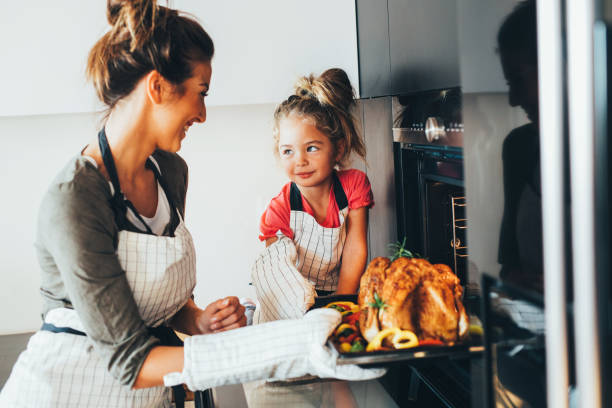 istock Mother taking the dinner out of the oven 861552740