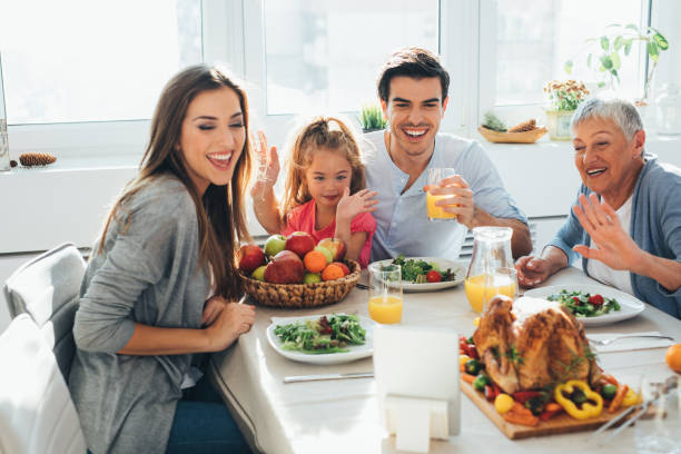 istock Family having a video call during dinner 861552756