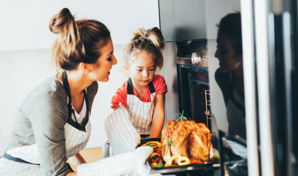 istock Mother taking the dinner out of the oven 861552766