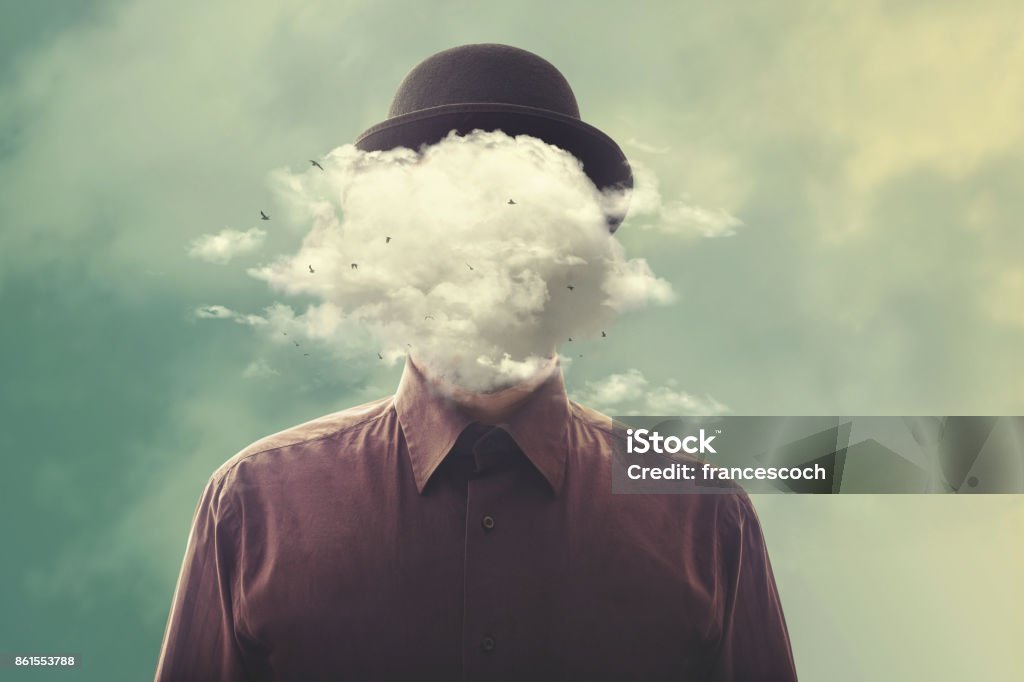surreal man head in the cloud man with bowler with cloud over his head Obscured Face Stock Photo