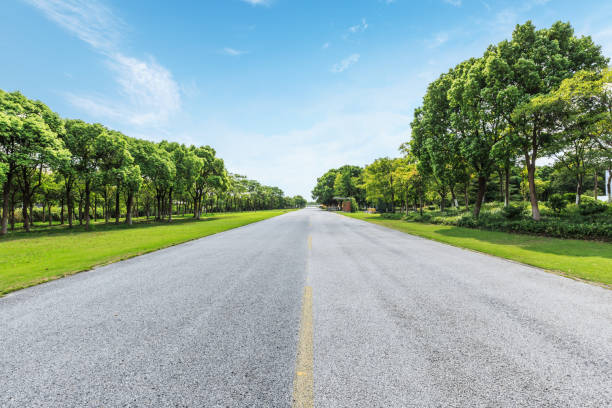 istock asphalt road and green forest under the blue sky 861553822