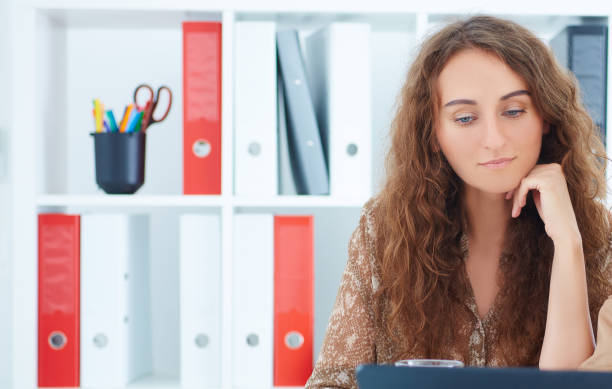 istock Businesswomen with digital tablet sitting in modern office 861560378