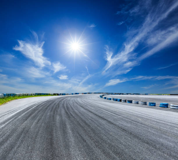 istock Asphalt road circuit and sky clouds with car tire brake 861561134