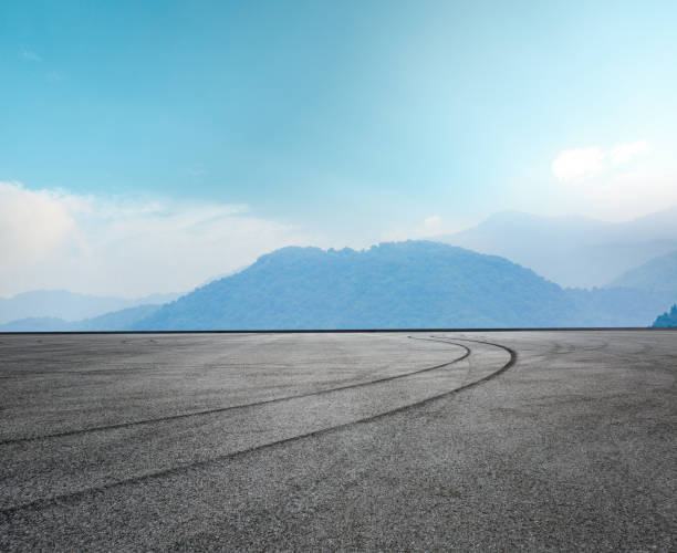 istock Asphalt road circuit and mountain under the blue sky 861563786