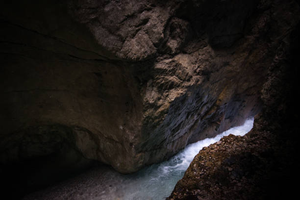 Bridge over the fast mountain river with blue water in Partnach Gorge of in Bavaria, Germany
