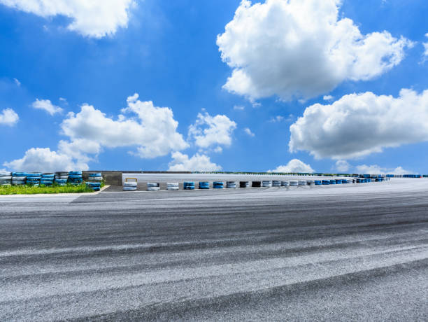 istock Asphalt road circuit and sky clouds with car tire brake 861568664