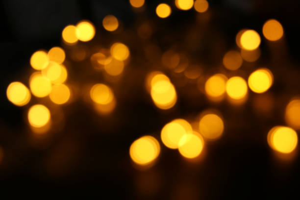 istock abstract bokeh background of golden light burst 861569048