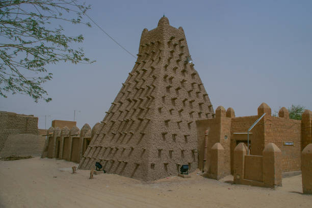 Djenne,Mali-March 13th 2006:A busy and colourful market scene in front of the great mud Mosque in the Saharan town of Djenne