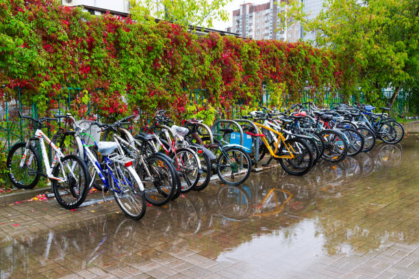 Zelenograd, Russia - September 15. 2017. Bicycle parking at Kryukovo station in fall in a puddle stock photo