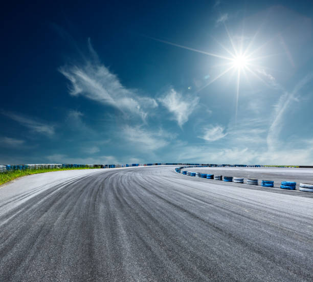 istock Asphalt road circuit and sky clouds with car tire brake 861575470