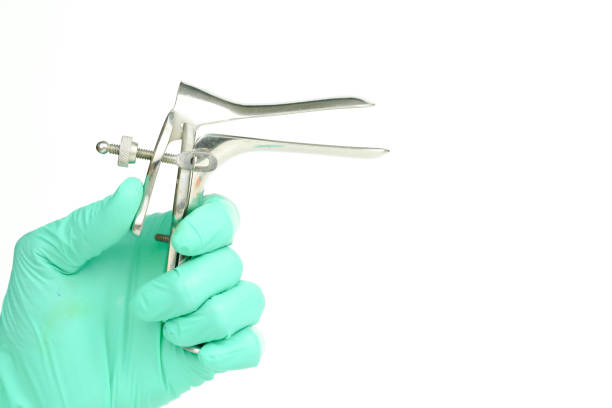 istock doctor hand holding speculum on white background 861579584