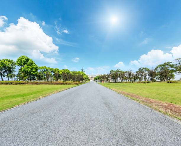 istock asphalt road and green forest under the blue sky 861579836