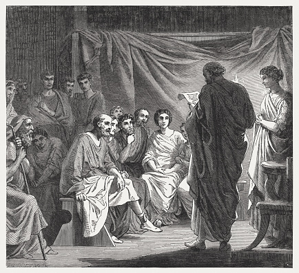 A meeting of the first Christians in Rome - a letter from Paul is read. Wood engraving, published in 1886.