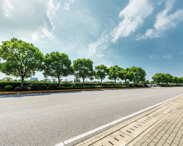 istock asphalt road and green forest under the blue sky 861579990