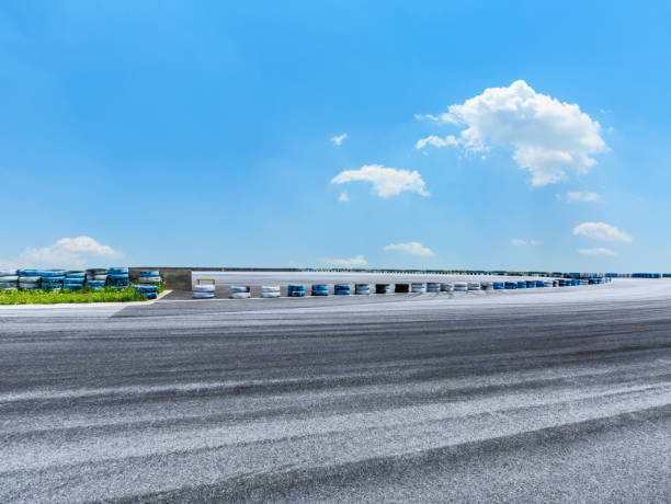 istock Asphalt road circuit and sky clouds with car tire brake 861580310
