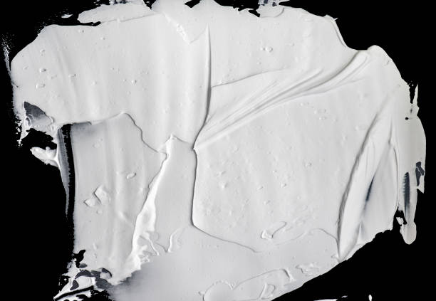 istock White wet paint or cream isolated on black background for ideas 861580436
