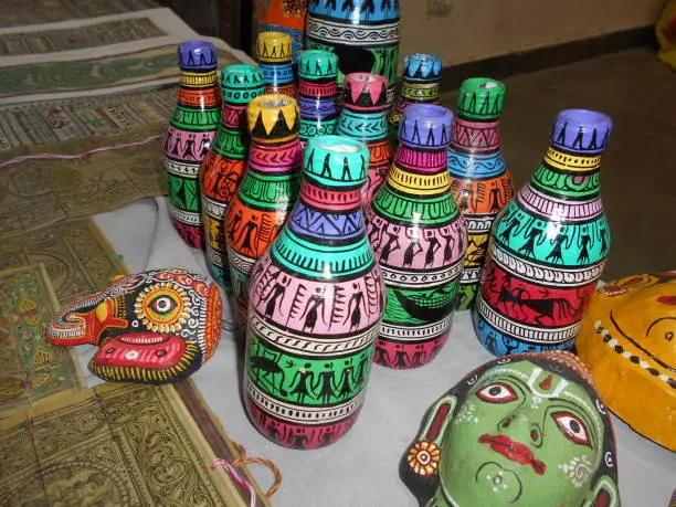 Colorful handmade bottles displayed in a shop.