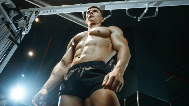 istock Handsome model young man working out in gym 861584016