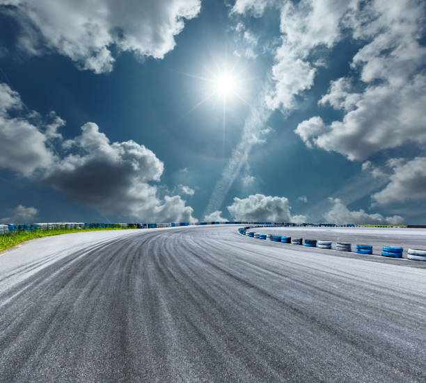 istock Asphalt road circuit and sky clouds with car tire brake 861584574