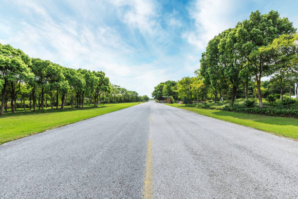istock asphalt road and green forest under the blue sky 861587814
