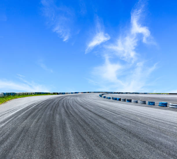 istock Asphalt road and sky clouds with car tire brake 861588768