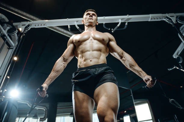 istock Brutal Caucasian bodybuilder training chest in gym 861588796