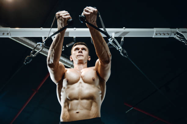 istock Handsome model young man working out in gym 861588874