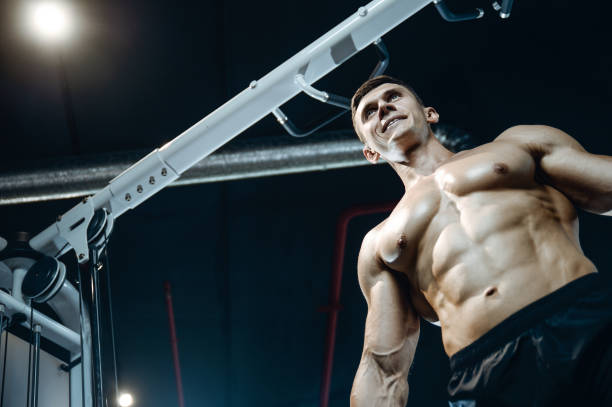 istock Handsome model young man working out in gym 861591250
