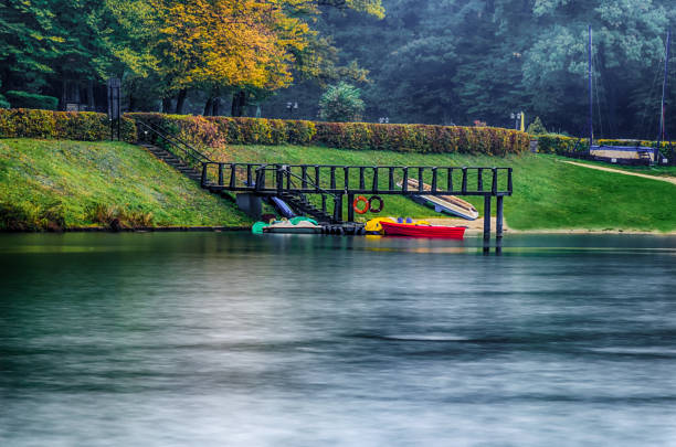 Pedal boat in the lake water during sunset time.