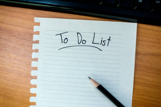 istock work desk with writing to do list in paper 861595792