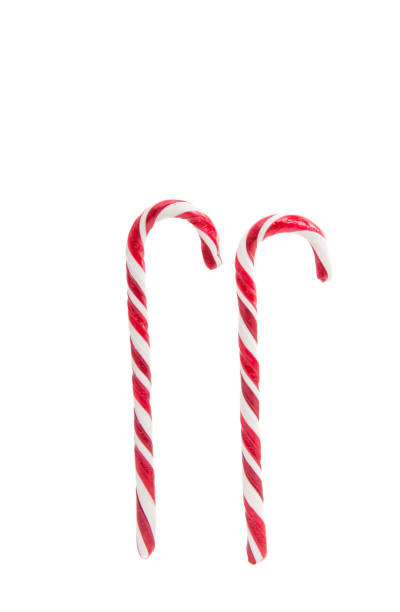 istock Christmas decoration. Traditional holiday candy cane isolated on white. 861595900