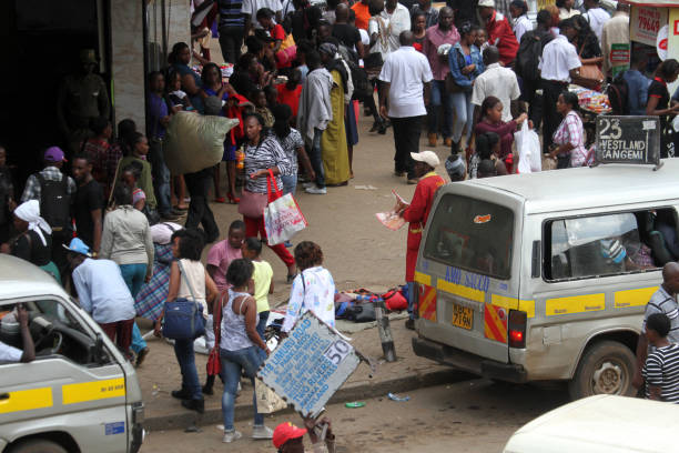 Naivasha, Kenia - January 07, 2024: Two people on the truck say hallo