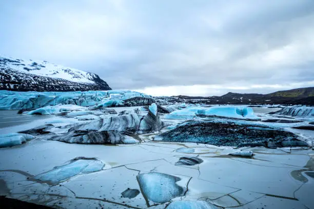 Glacier in Iceland - Blue icebergs floating in the lagoon