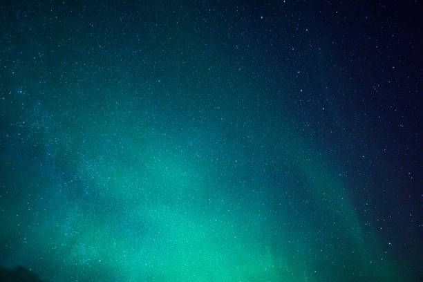 Multicolored northern lights - Aurora borealis - sky close up in Iceland