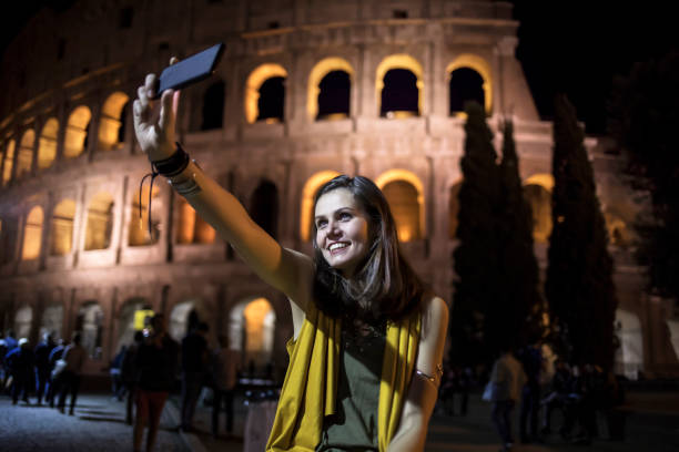 istock Smiling young woman taking selfie in Rome 861618340