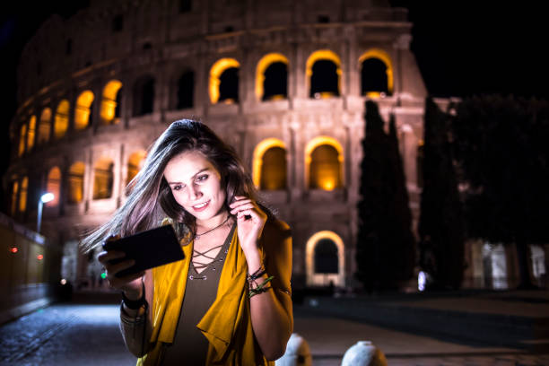 istock Smiling young woman taking selfie in Rome 861618350