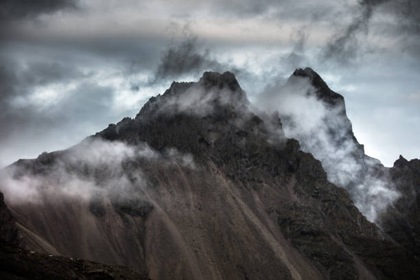 amazing view of top of the mountain with clouds around