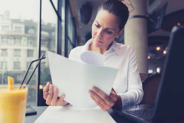 istock Pensive beautiful young businesswoman using laptop in a cafe 861625870