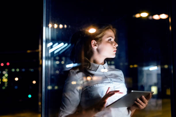 istock Businesswoman with tablet working late at night. 861632430