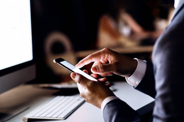 istock Unrecognizable businessman in the office at night. 861634560