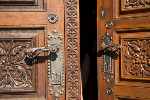 Retro classic wooden door and anitque lock door old style of Church of St. Ludmila at namesti miru or Peace Square in Prague, Czech Republic
