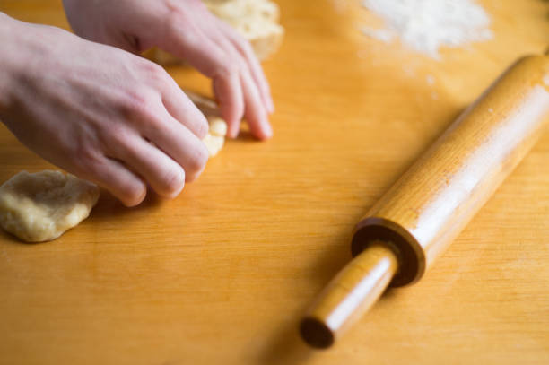 istock Woman kneading a dough on the table 861638806