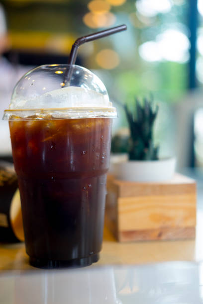 istock Iced black coffee on wooden table 861648908