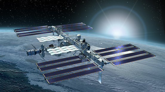 3D Rendering of the International Space Station flying above Earth, from its zenith solar panels and the detailed modular architecture.
